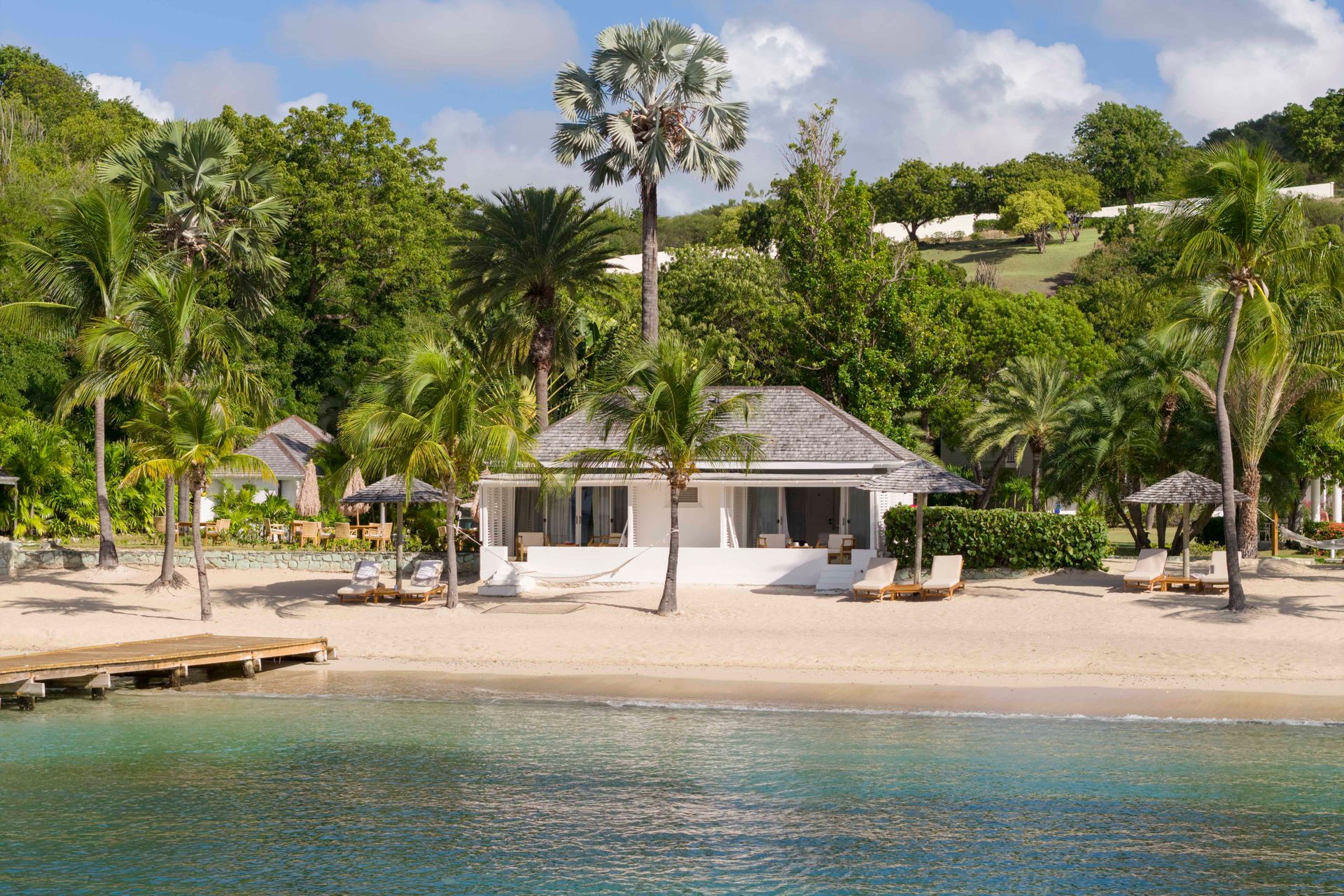 Beach Cabana veranda and tropical garden at The Inn at English Harbour