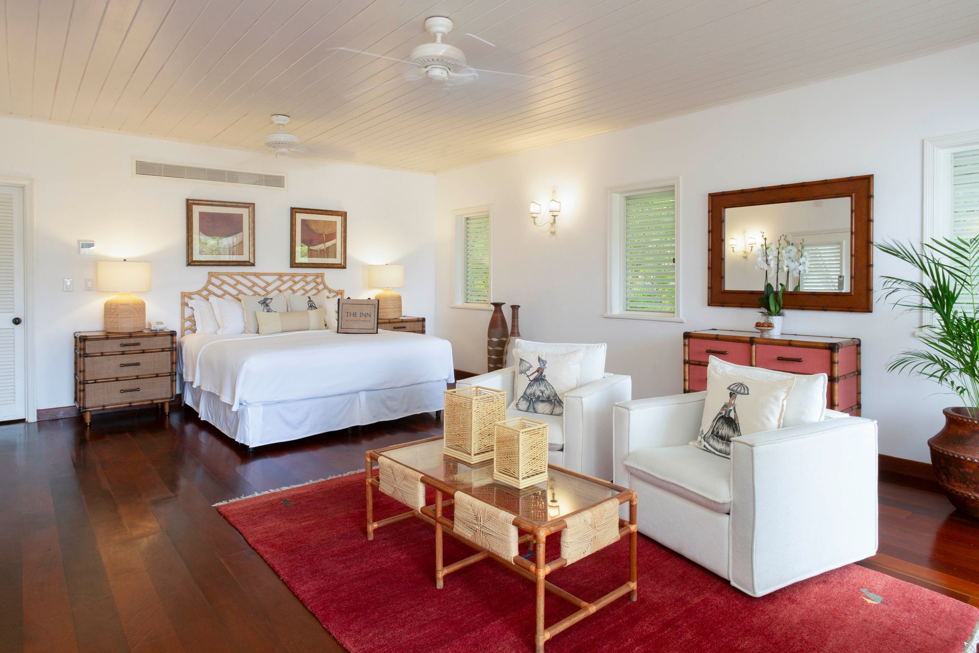 Junior Suite living room with white decor at The Inn at English Harbour