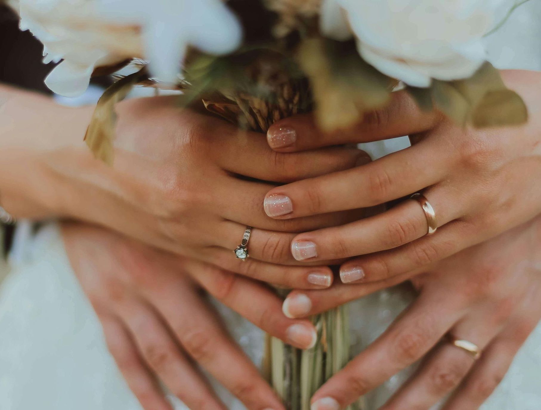 Vow renewal ceremony hands with rings at The Inn at English Harbour